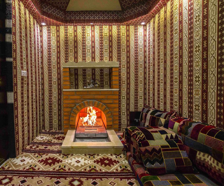 Rest Night Serviced Apartments- Alhamra Riad Exterior foto A majlis with a fireplace